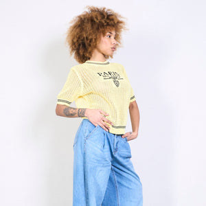 Textured knit top with lettering in yellow