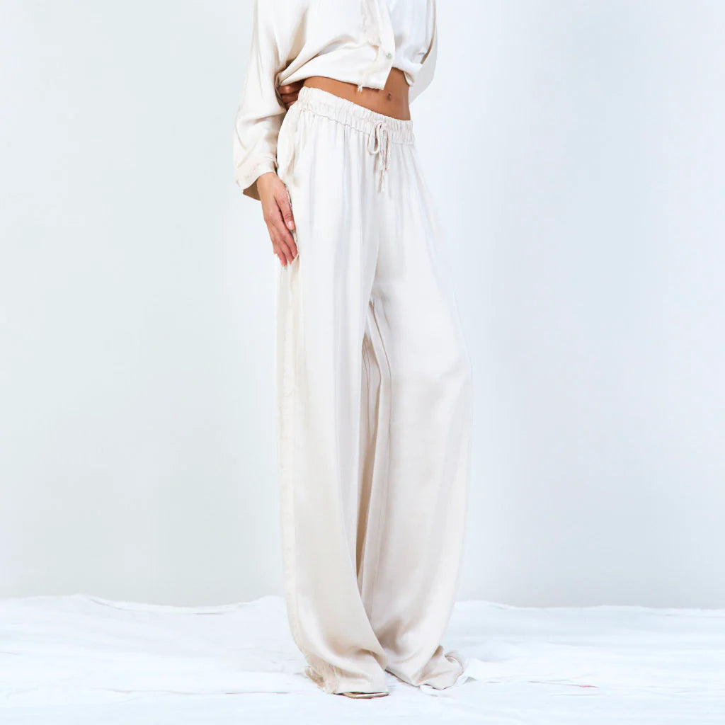 Frayed wide-leg trousers with drawstring in beige